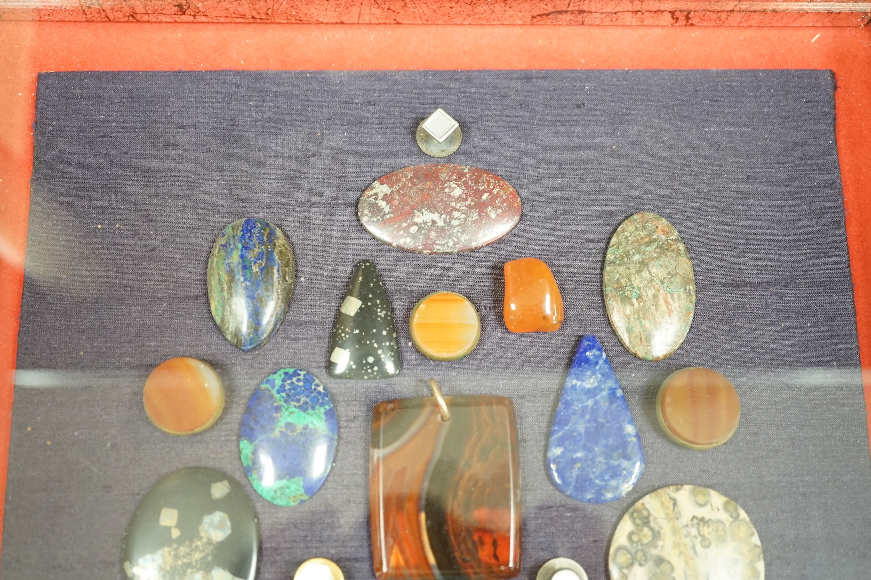 A framed case of mixed agates, 34cm x 38.5cm